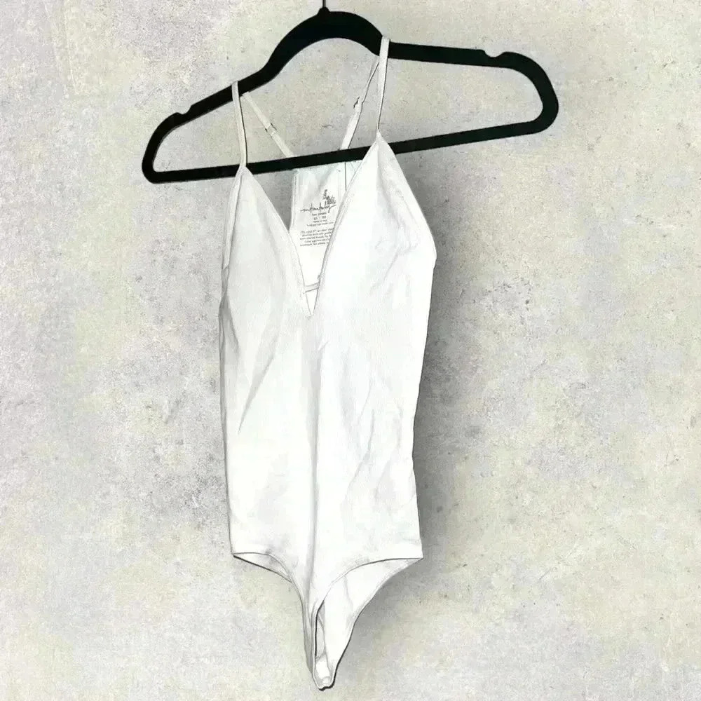Nwot white free people body suit size XS/S